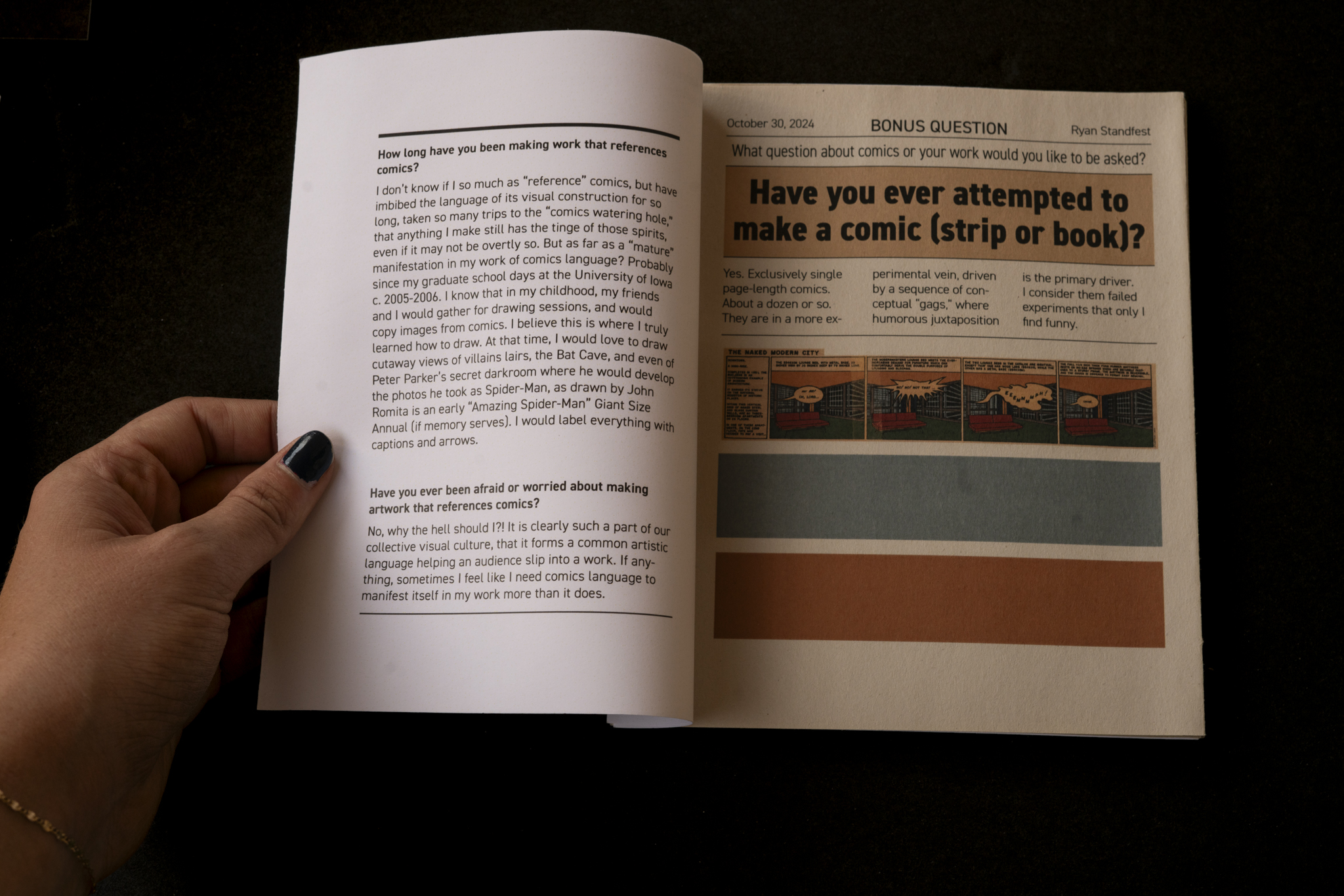 two page layout of not approved zine in book with hand holding it open