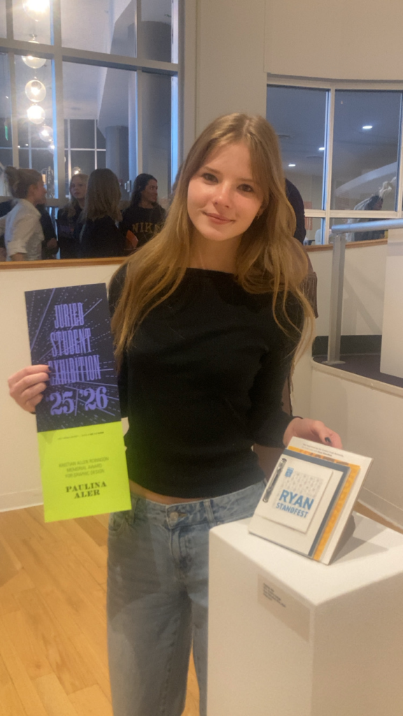Paulina holding award and Ryan Standfest Zine
